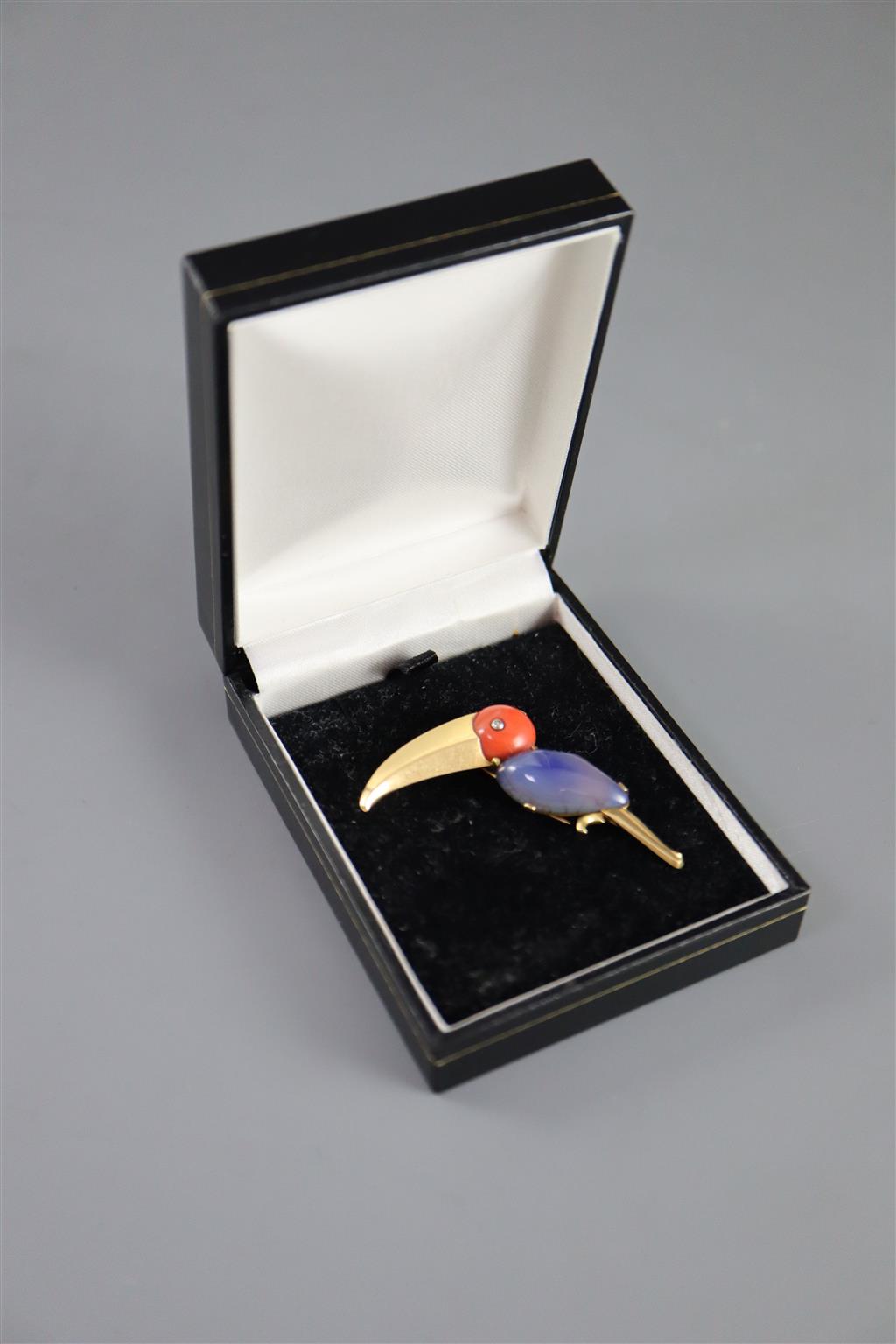 A mid 20th century French 18ct gold, coral and cabochon blue chalcedony? set Toucan clip brooch by J. Lacloche, Paris/Cannes,
